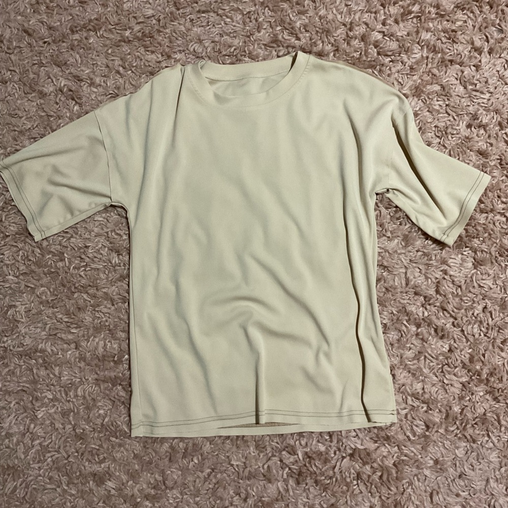 Hello! I am selling a t-shirt with very luxurious material and a pink color.